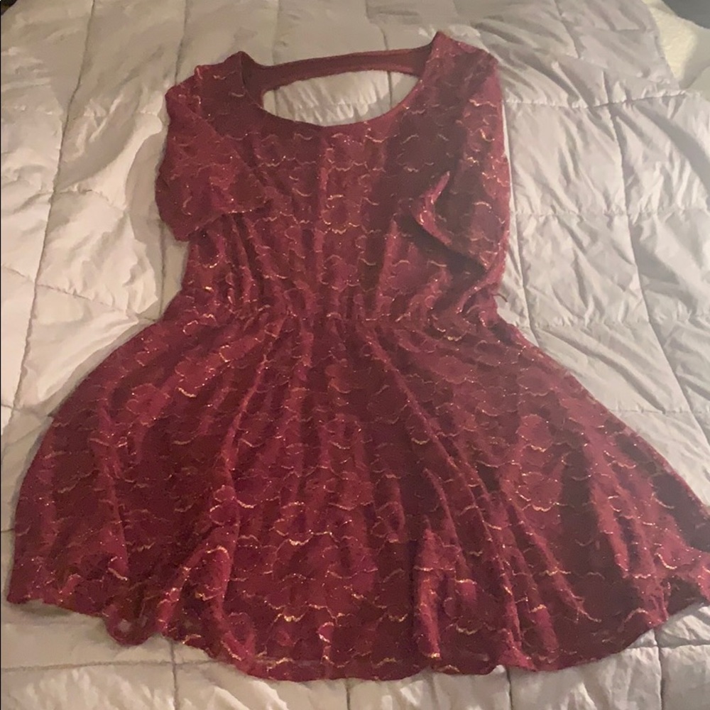 Burgundy with gold tone women’s dress.